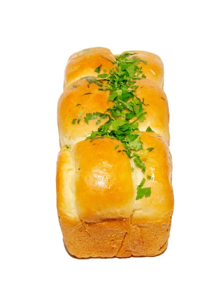 Goldenes frisches Brot mit Grüntönen isoliert auf Weiß. — Stockfoto