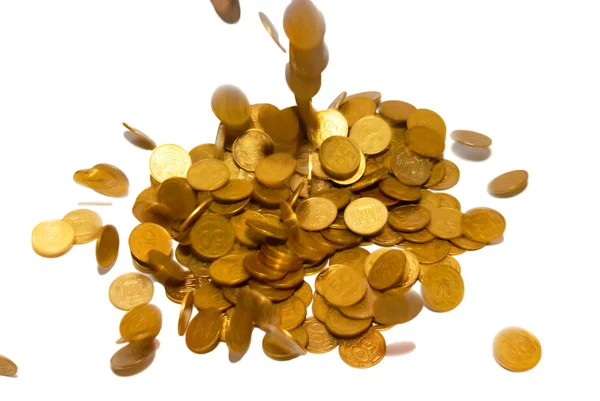 Pioggia di monete d'oro isolate su bianco . — Foto Stock