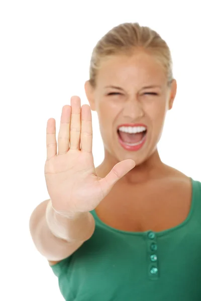 Helles Bild einer jungen Frau mit Stopp-Geste. — Stockfoto