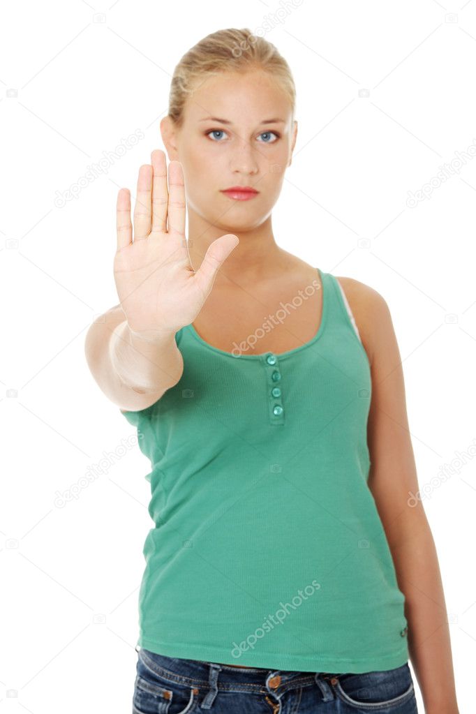 Bright picture of young woman making stop gesture.