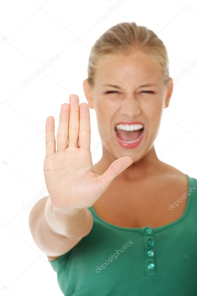 Bright picture of young woman making stop gesture.