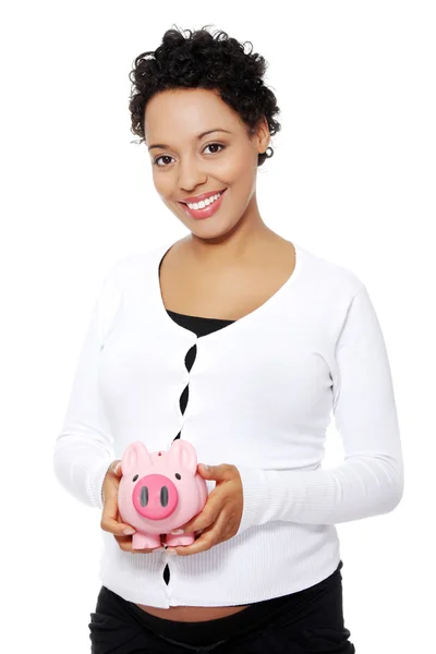 Pregnant woman holding piggy bank — Stock Photo, Image