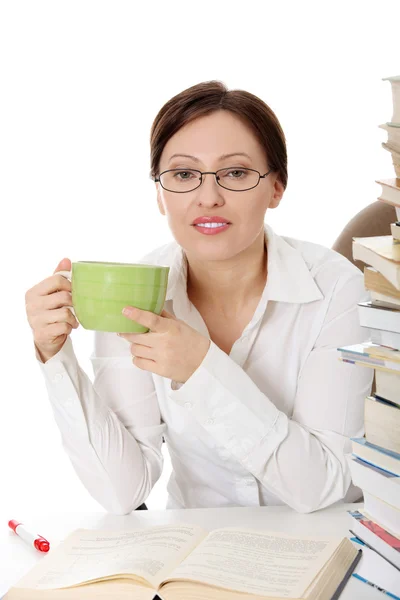 Mature student woman at the desk — Stock Photo, Image