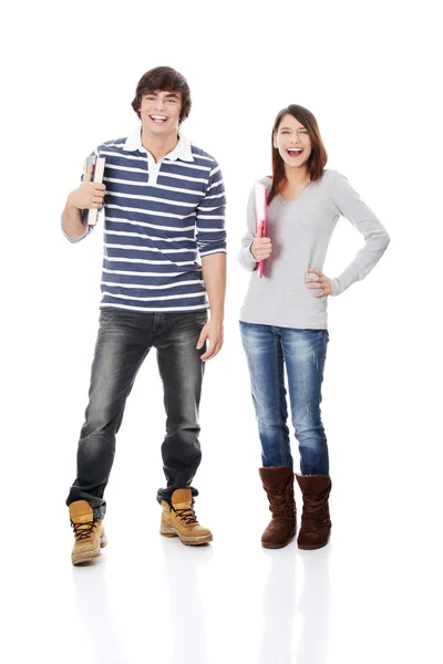 Young woman and man standing with books — Stock Photo, Image