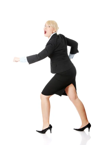 Middleaged businesswoman running Stock Image