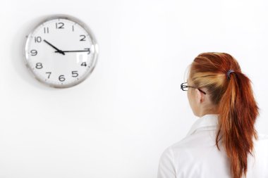 Caucasian woman looking at the clock clipart
