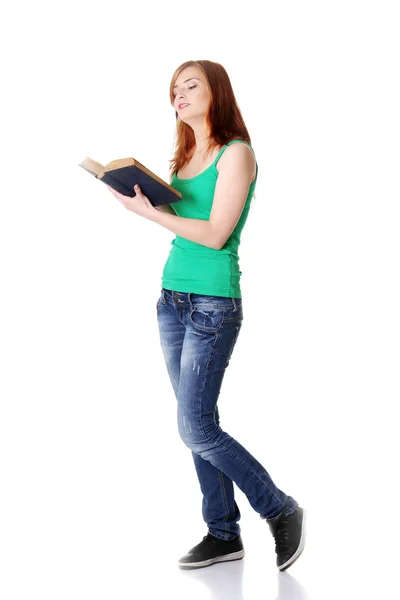 Standing teen girl reading a book. — Stock Photo, Image