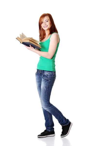 S úsměvem teen student drží knihu. — Stock fotografie