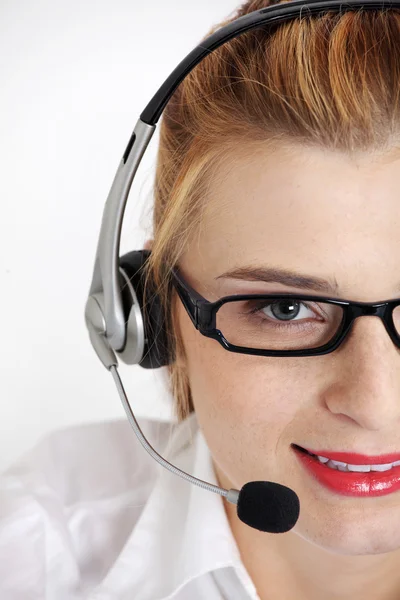 Close up on woman 's face with headset . — стоковое фото