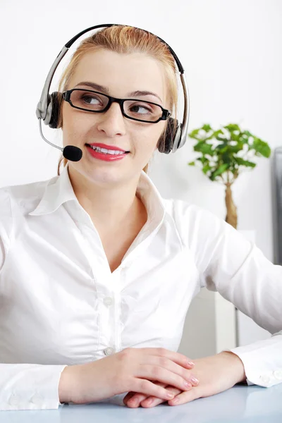 Smiling blonde woman with headset. — Stock Photo, Image