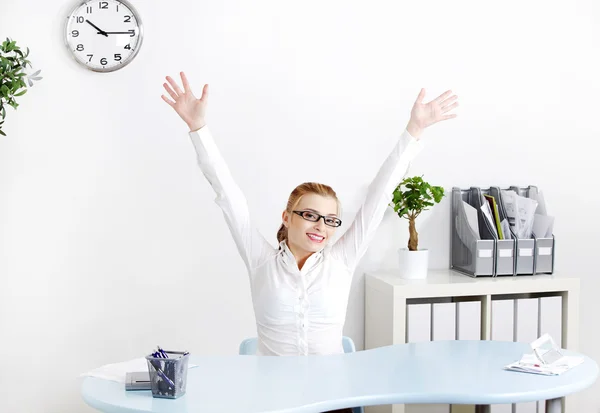 Young woman in the office with hands in the air. — Stock Photo, Image