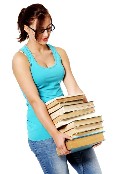 Jeune adolescent étudiant avec des livres sur blanc . — Photo
