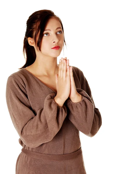 Mladá dívka stojící a modlit se. — Stock fotografie