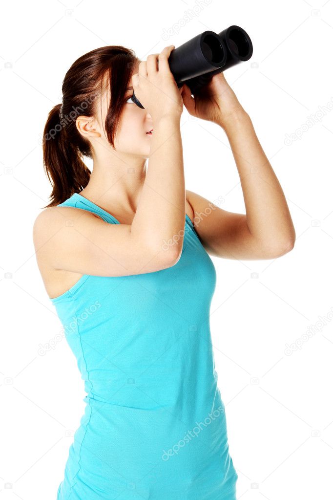 Teen student looking through binoculars.