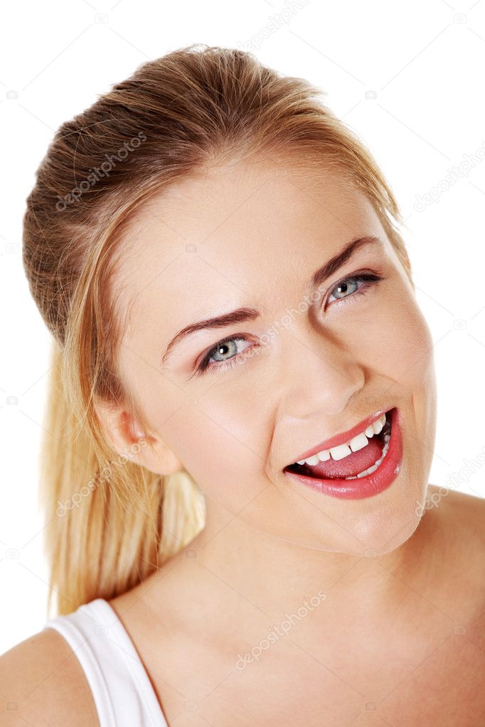 Blonde girl smiling with open mouth.