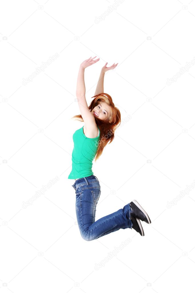 Teenage student jumping.
