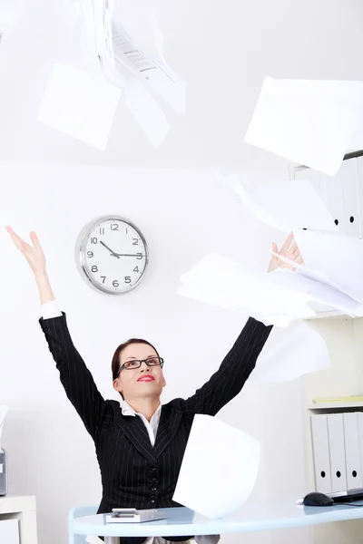 Businesswoman throwing sheets of paper. — Stock Photo, Image