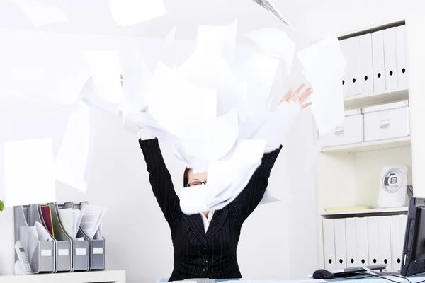Woman throwing sheets of paper. — Stock Photo, Image