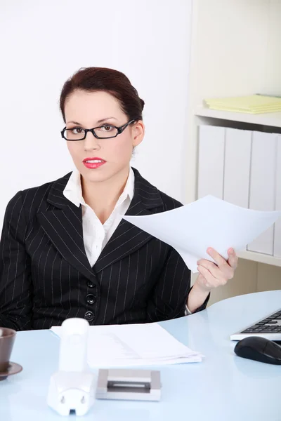Businesswoman holding papers. Stock Image