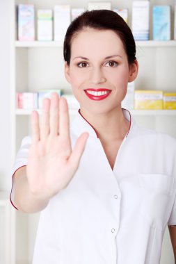 Pharmacist showing stop gesture. clipart