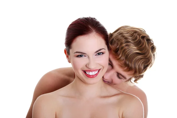 Topless menino beijando sua namorada nua . — Fotografia de Stock