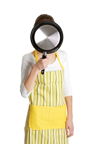 Smiling female teen with a frying pan. — Stock Photo, Image