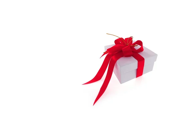 Vánoční dárek s červenou stužku — Stock fotografie