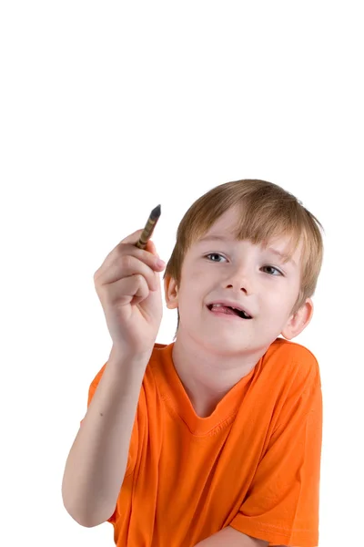 Jongen trekt iets met een potlood — Stockfoto