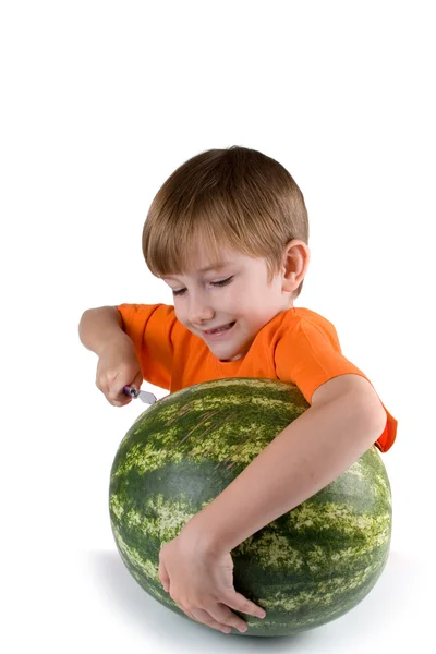 Boy cut watermelon — Stock Photo, Image