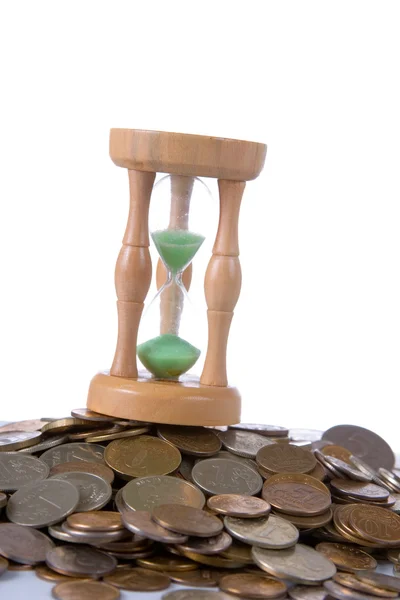 Coins and hourglass — Stock Photo, Image