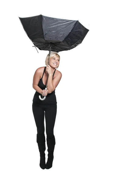 Kvinna anläggning paraply — Stockfoto