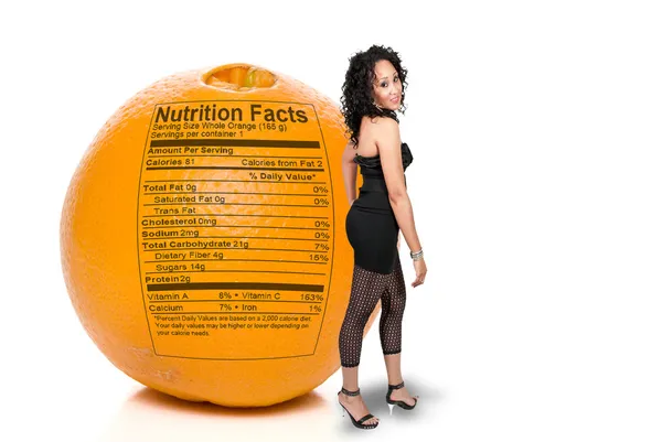 Black Woman with Orange Nutrition Facts — Φωτογραφία Αρχείου