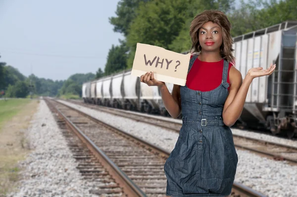 Kobieta trzymająca znak "Dlaczego" — Zdjęcie stockowe