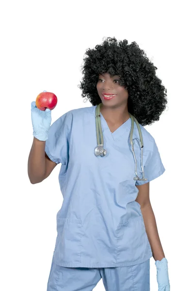 Médico femenino con una manzana — Foto de Stock