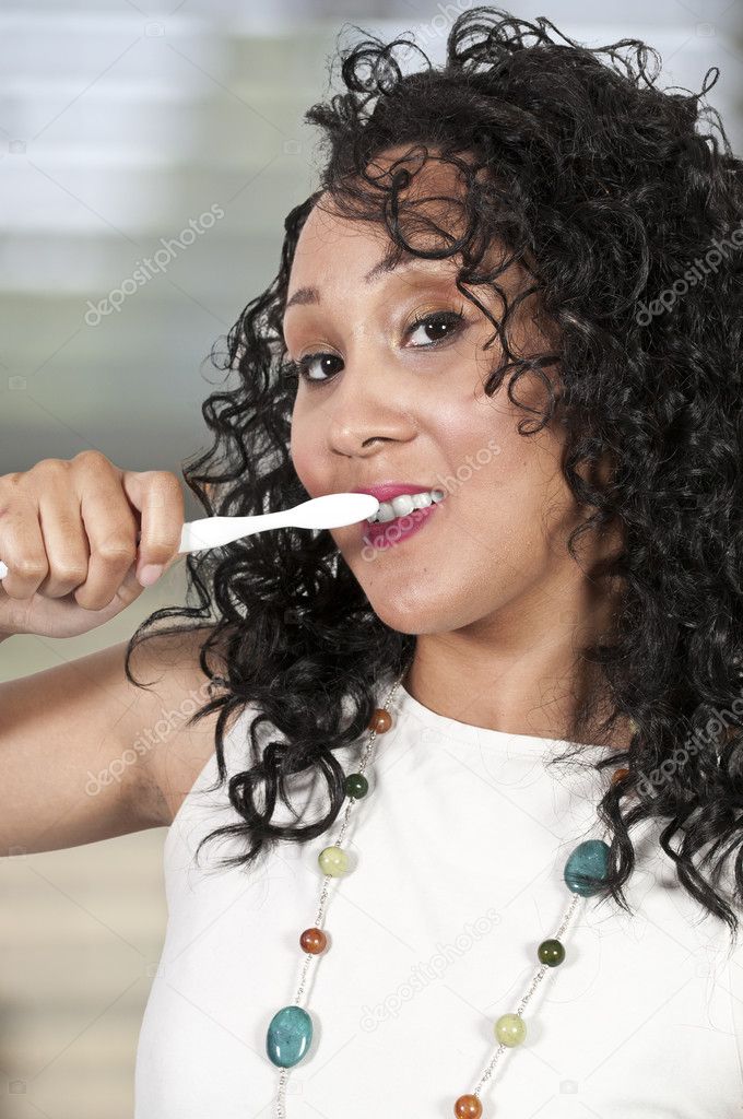 Beautiful Black Woman Brushing Teeth