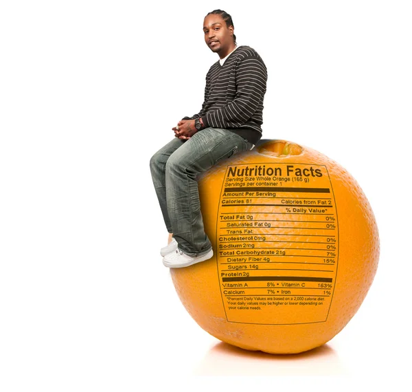 Black Man and Orange Nutrition Facts — Stockfoto