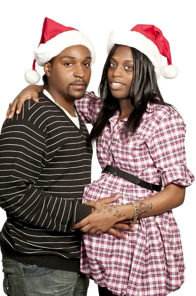 Schwarzes Paar mit Weihnachtsmann-Hüten — Stockfoto