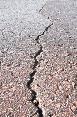 Close-up of crack on the road clipart