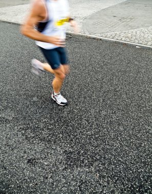 Man running in city marathon, motion blur clipart