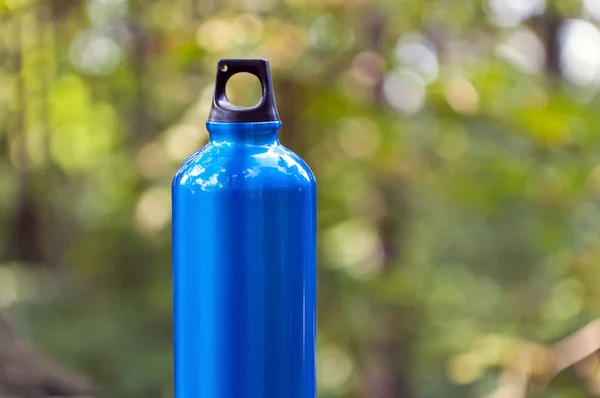 stock image Water bottle in green forest