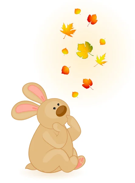 Sonbahar yaprakları ile küçük oyuncak tavşan karikatür — Stok Vektör