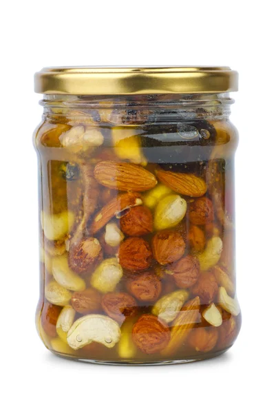 Скляна банка з медом, горіхами та інжиром — стокове фото
