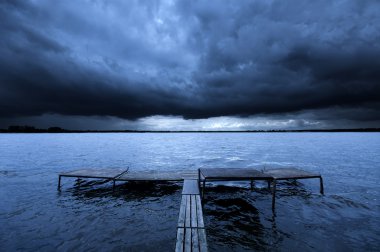 Old pier and dramatic sky clipart