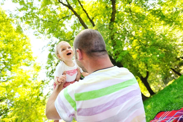 Man and baby playing in park — Stock Photo, Image