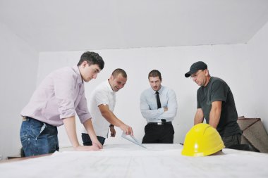 Team of architects on construciton site clipart