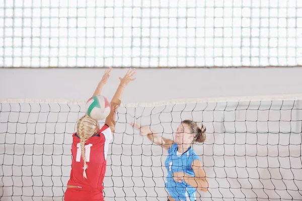 stock image Girls playing volleyball indoor game