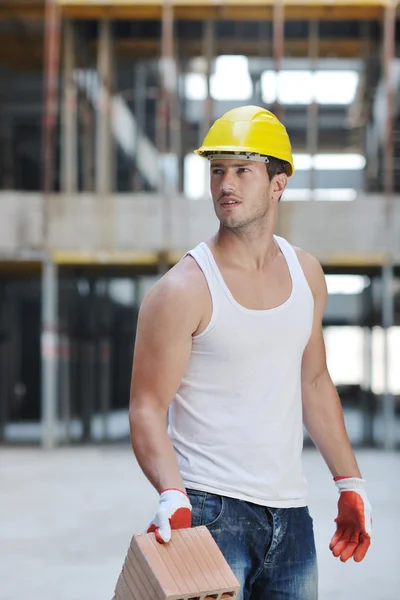 Hard worker on construction site Stock Picture