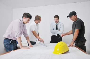 Team of architects on construciton site clipart