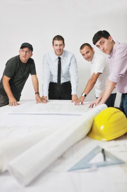 Team of architects on construciton site clipart