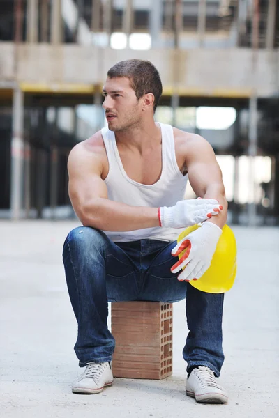 Hard worker on construction site Stock Picture